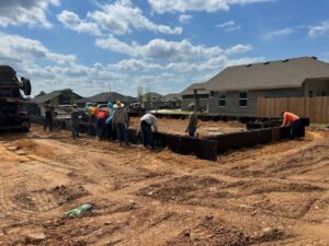 leveled dirt with pier and grade beam foundations