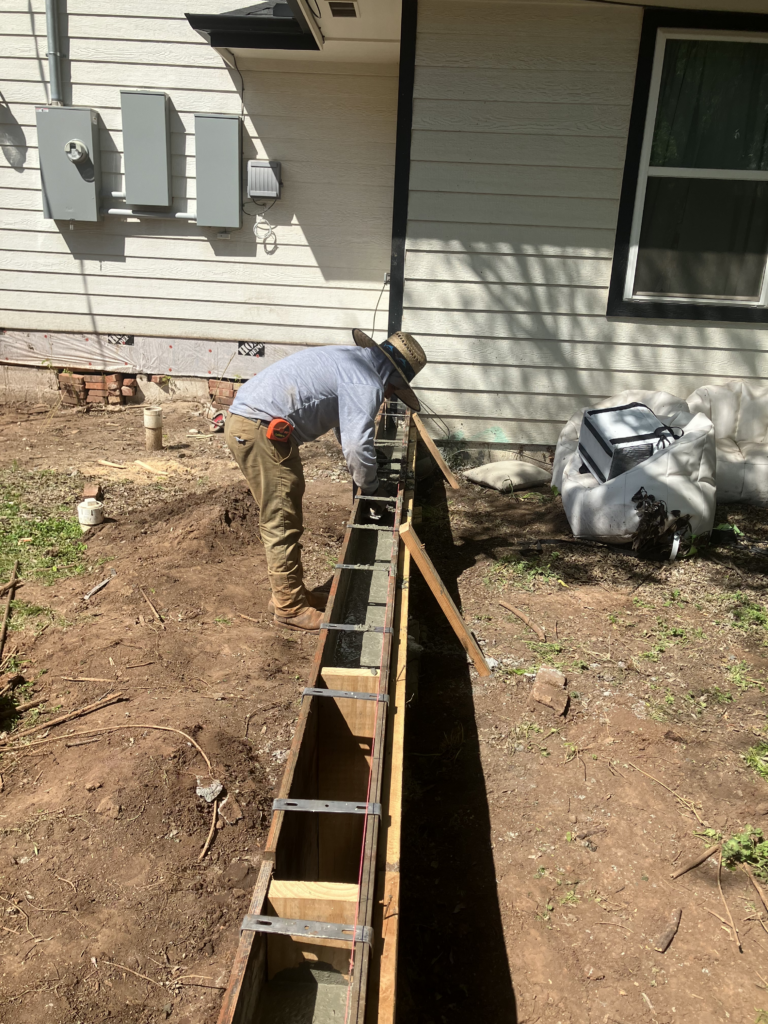 man setting up foundation for concrete