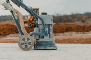 concrete grinder on top of concrete surface